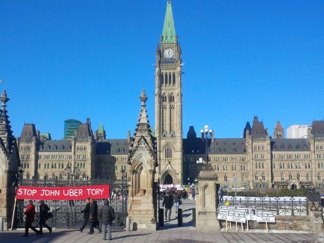 Issue Hundreds rally against Uber on Parliament Hill