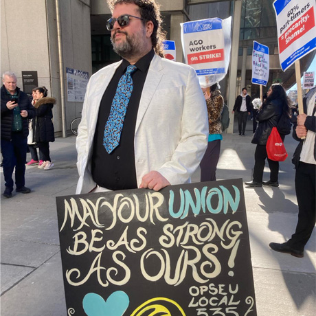 Issue AGO strike: "Shiny Building, Shabby Wages"