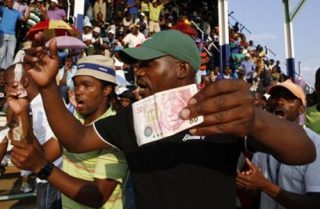 Issue South Africa platinum miners win as strikes spread